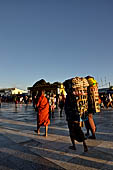 Myanmar - Kyaikhtiyo, porters carrying luggage's of the pilgrims. 